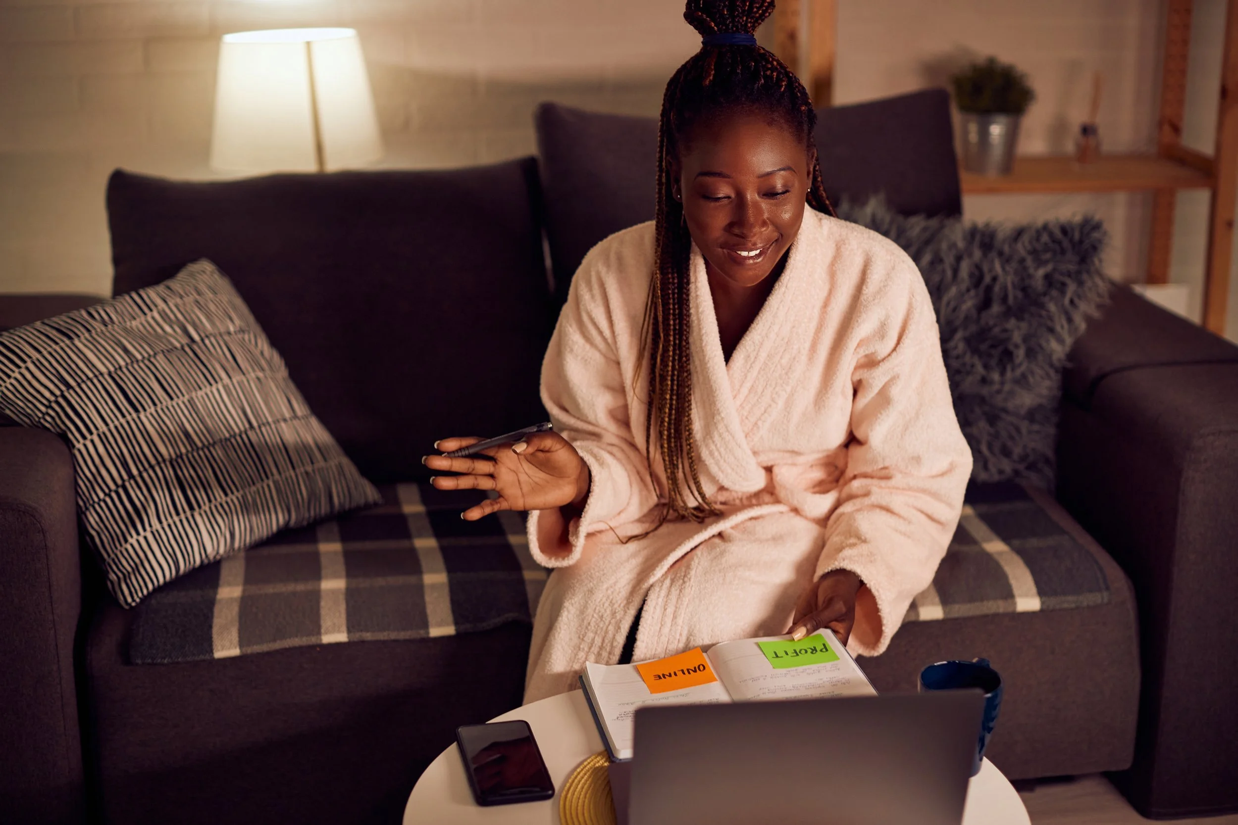 woman-working-remotely-on-couch-at-night-2026-09-21-11-42-51-utc.jpg