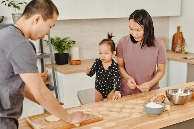 parents baking with their baby