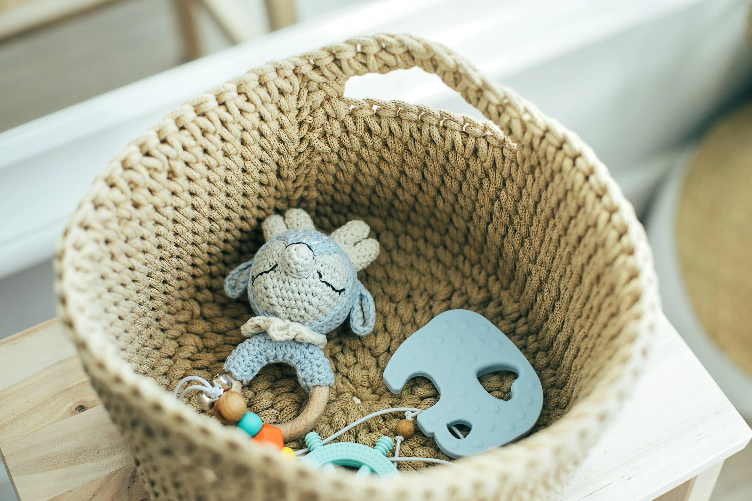 baby-stuff-and-accessories-in-knitted-basket