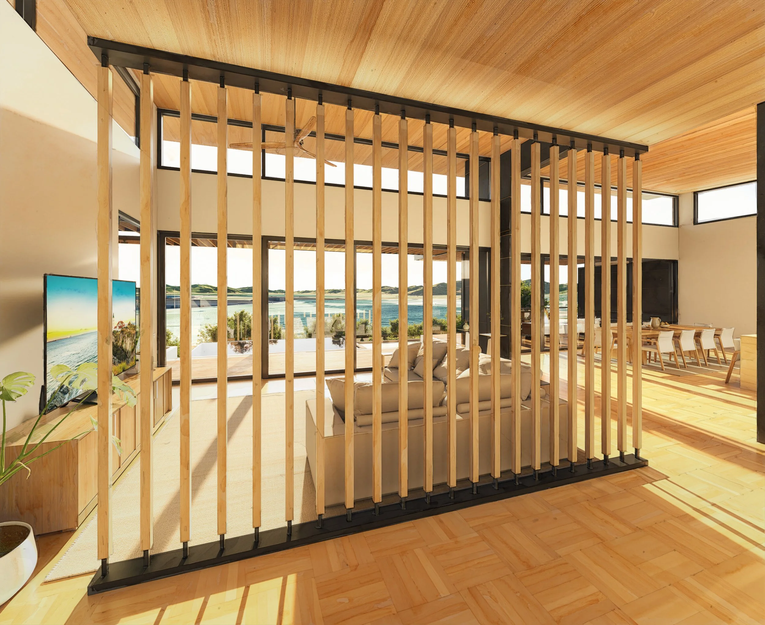 Interior partition and design details showing natural wood slats and sunlight streaming into Solara home.