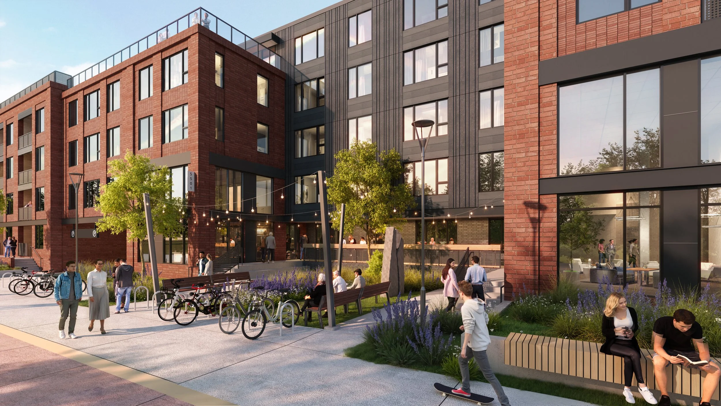 The Flatiron mixed-use development in Boulder, CO viewed from the corner of 55th Street and Arapahoe Avenue, highlighting pedestrian pathways, greenery, and street-level activity.
