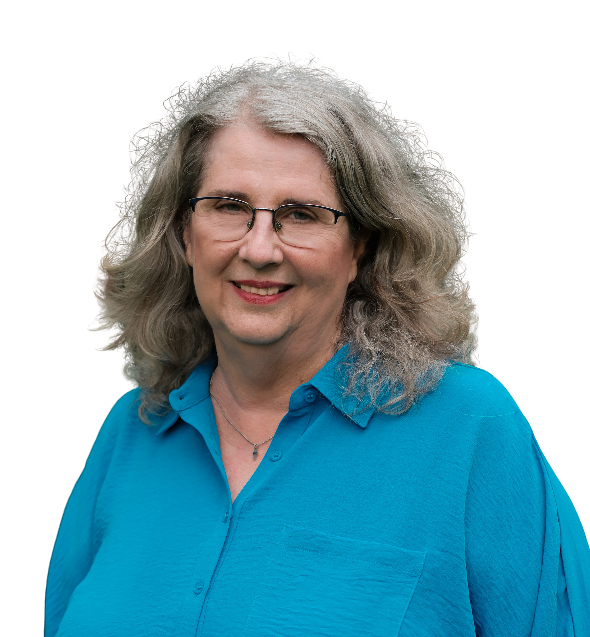 A middle-aged woman with short, wavy brown hair, glasses, and a white collared shirt, smiling at the camera.