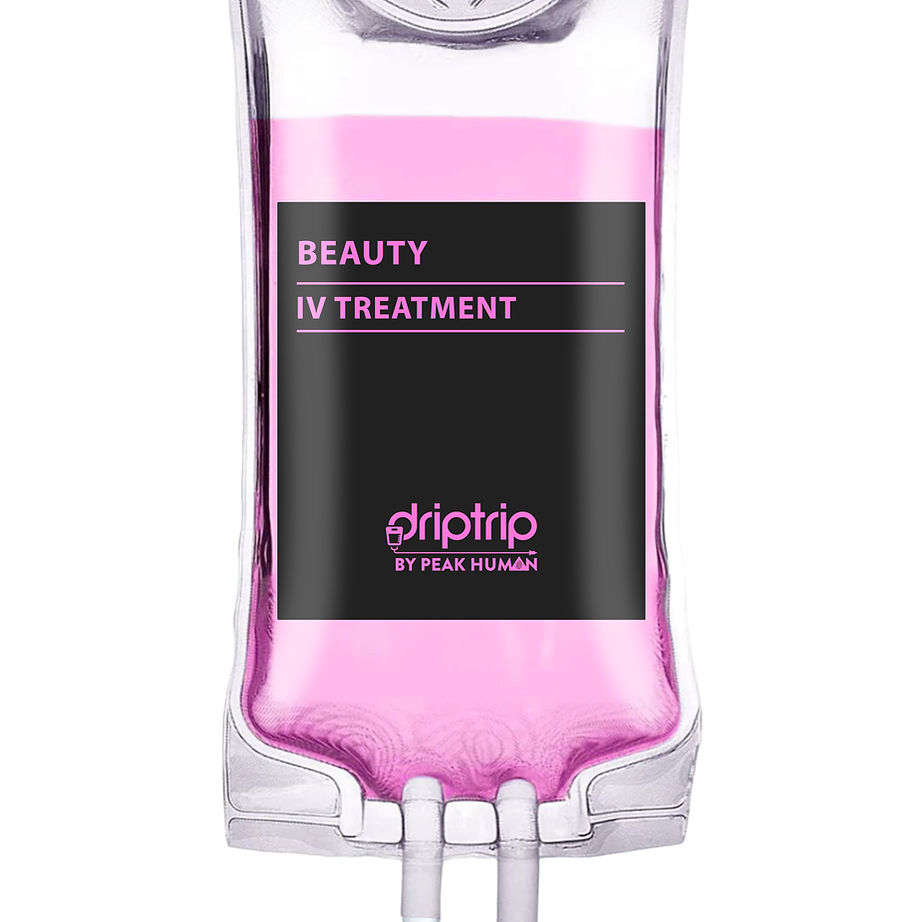 A clear IV drip bag filled with pink liquid, labeled 'Beauty IV Treatment' by Peak Human.