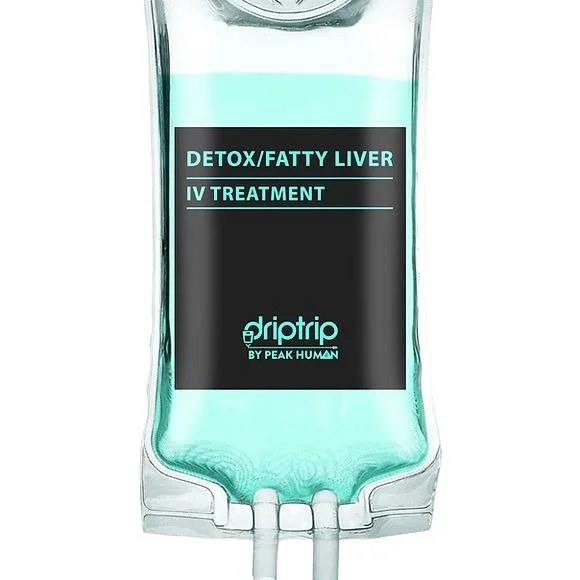 A clear IV bag labeled 'Detox/Fatty Liver IV Treatment' from Driptrip by Peak Human, filled with a turquoise liquid.