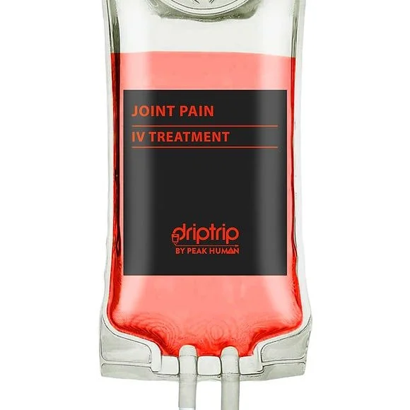 A clear IV bag filled with pink liquid labeled for joint pain IV treatment by Peak Human.