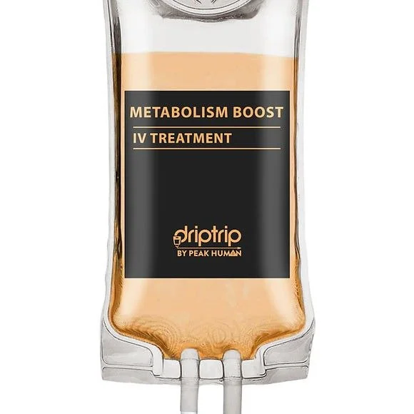 A transparent IV drip bag labeled 'Metabolism Boost IV Treatment' by Peak Human, containing orange-colored fluid.