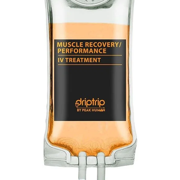 An IV bag labeled 'Muscle Recovery/Performance IV Treatment' by Driptrip with orange liquid inside.