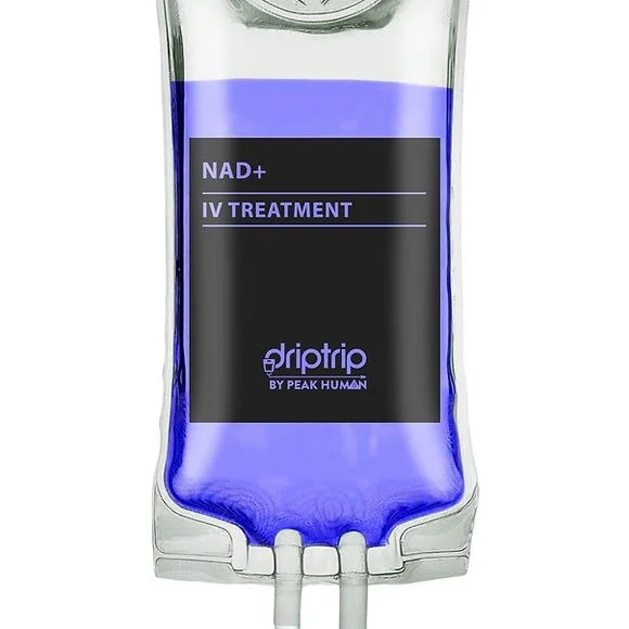 IV drip with a blue fluid labeled 'NAD+ IV Treatment' by Peak Human.