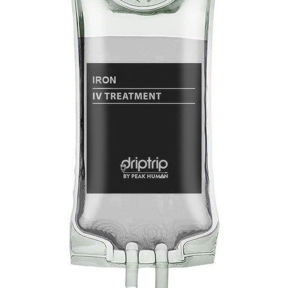 A clear IV drip bag labeled for iron IV treatment by Peak Human, filled with a dark liquid, with tubing at the bottom.