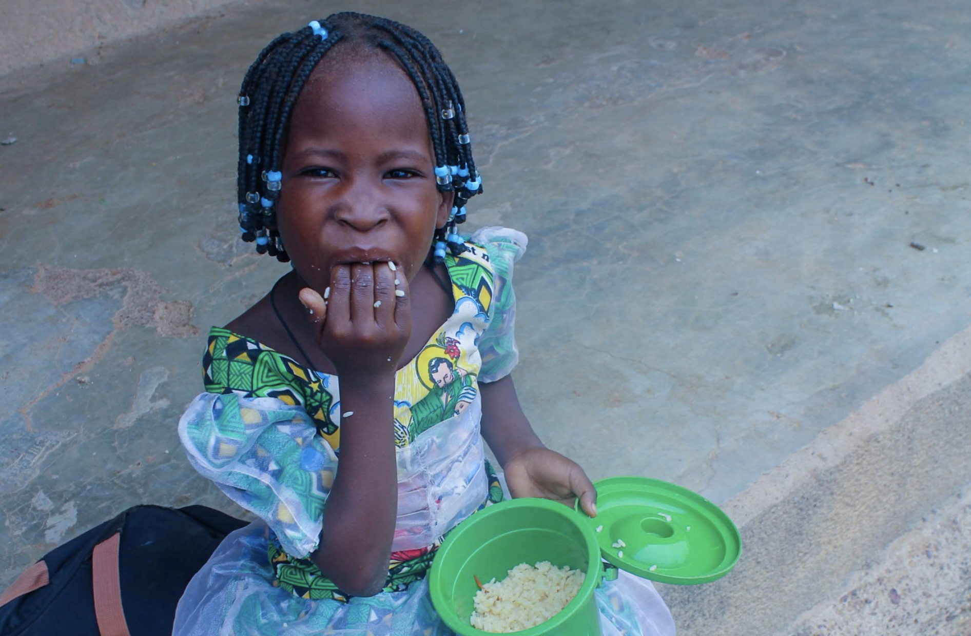 Girl eating rice