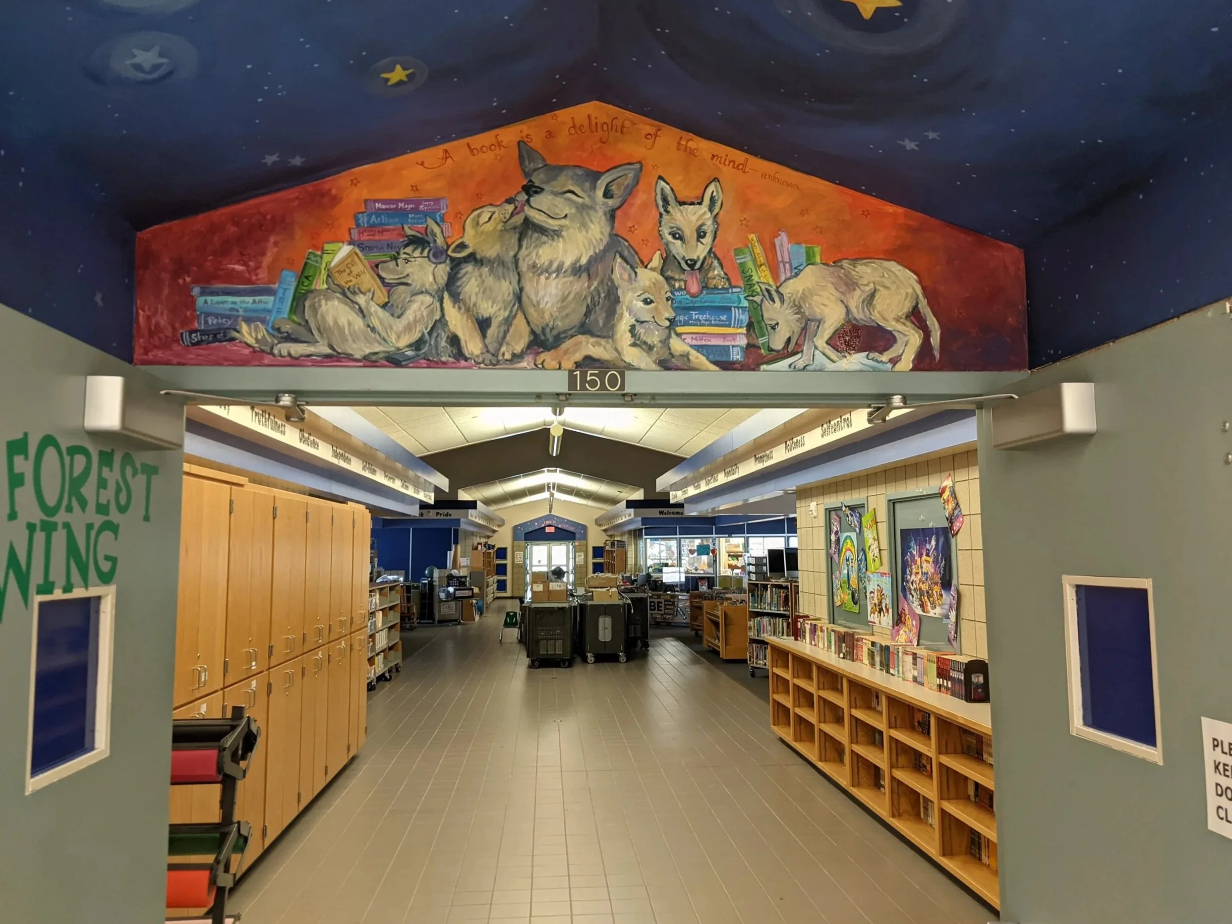 A book is a Delight for the Mind- mural over entrance to the Talahi Community School Media Center, 2012