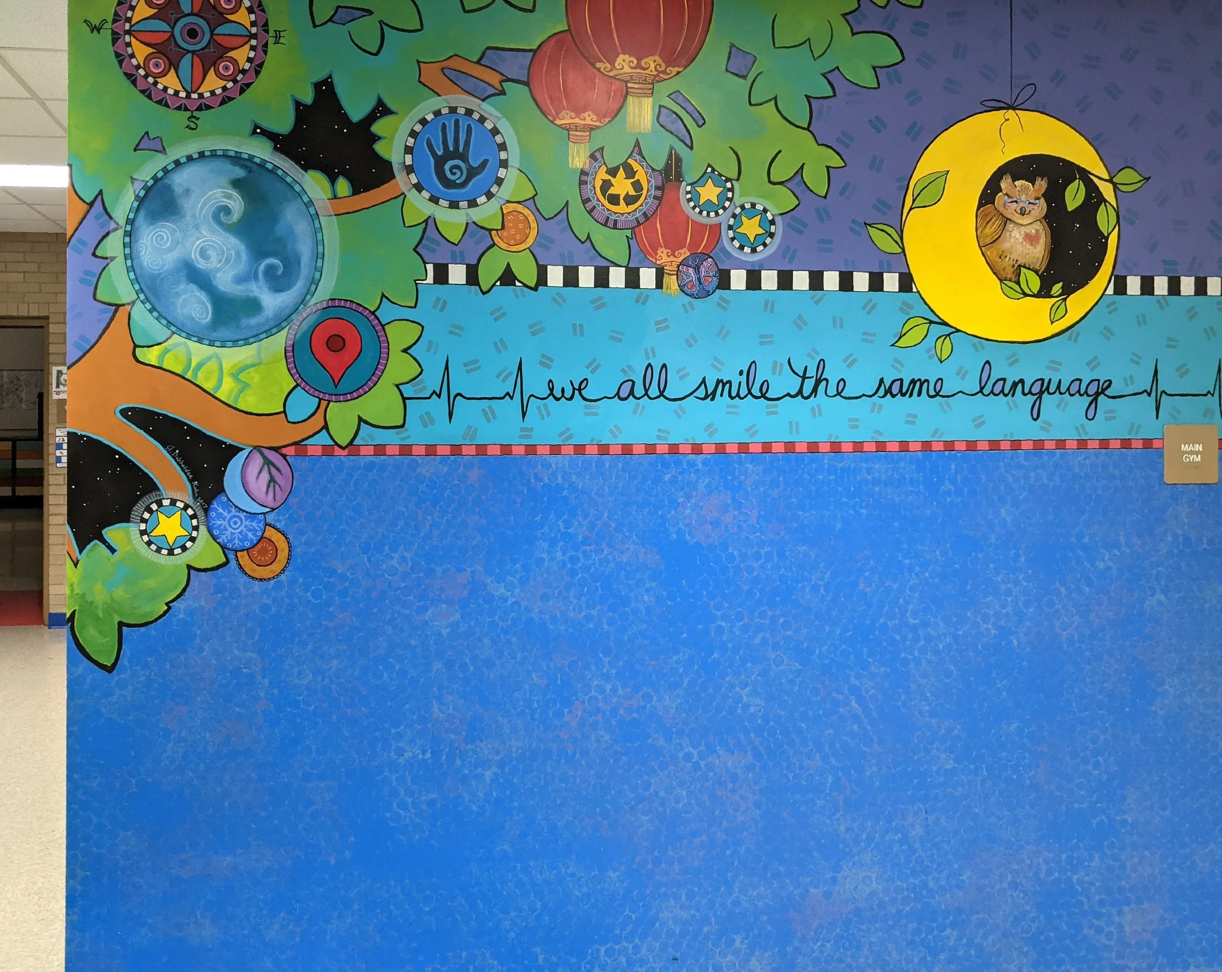 We All Smile the Same Language-  one wall of entry mural for Madison Community School, 2017 