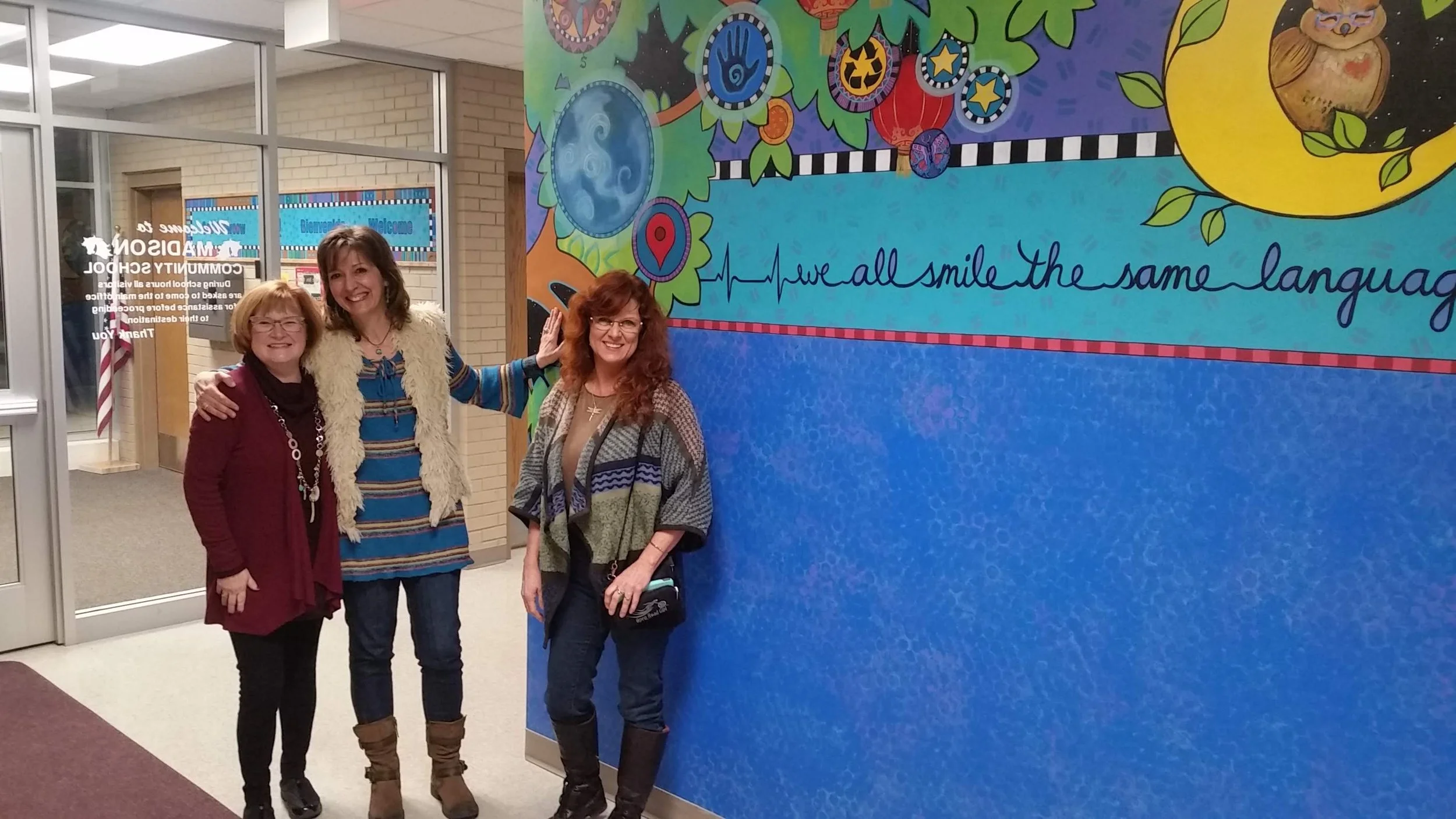 Celebration Time for Madison Mural of Color, Madison Community School, 2017. L to R: Principal Jean Clark, artist Jill Dubbeldee Kuhn  and Central MN Arts Board Executive Director, Leslie LeCuyer-Miezwa