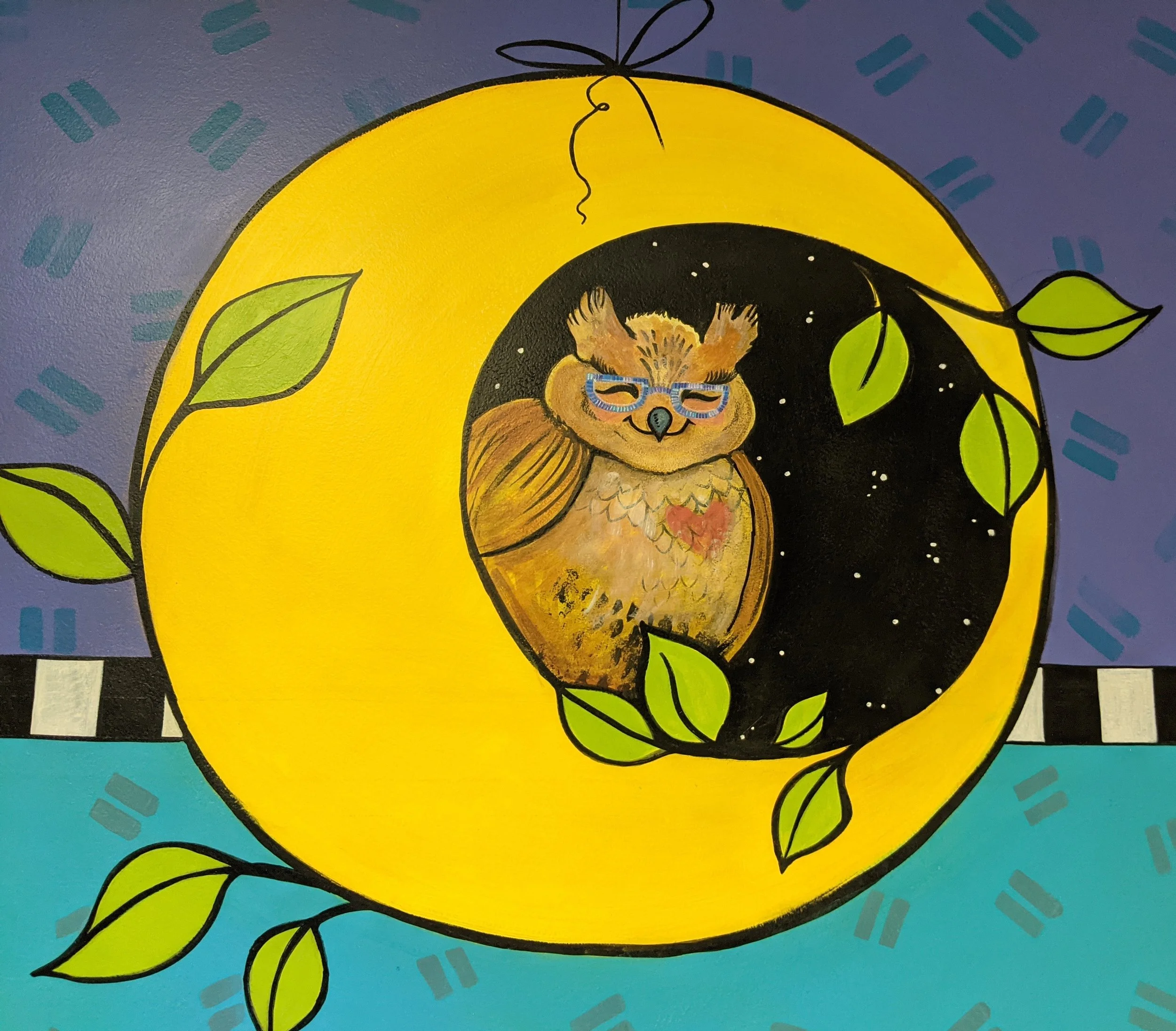 Close-up of entry mural -Wise Owl depicting Principal Jean at Madison Community School