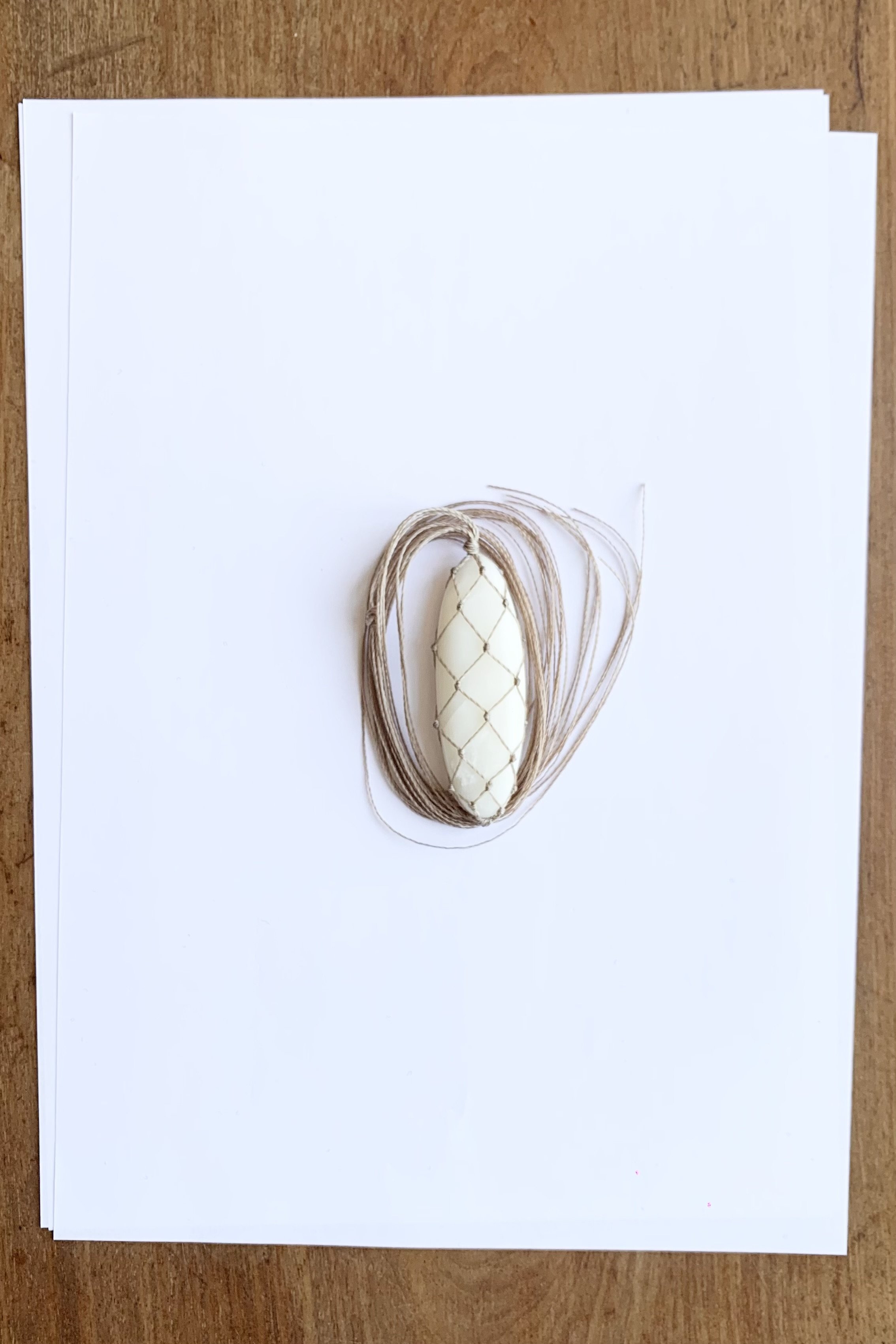 White jade macrame oval pendant necklace