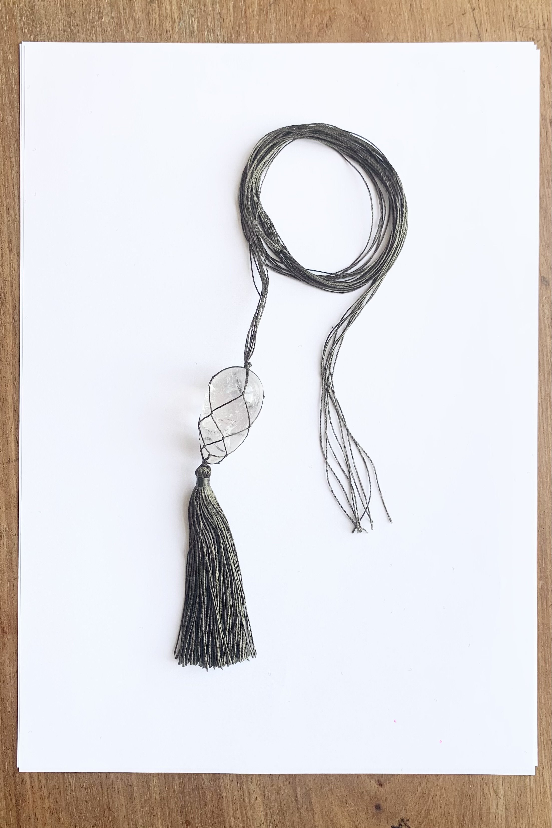 Crystal egg and silk tassel macrame pendant necklace