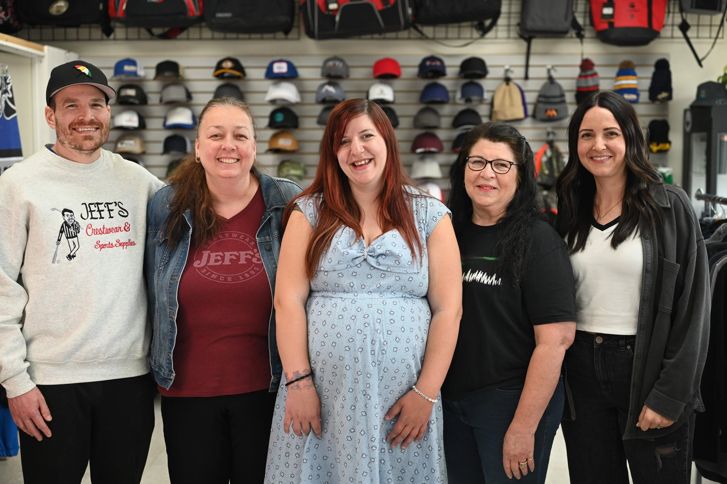 An image of the jeffs crestwears team. There are five people standing in the image.