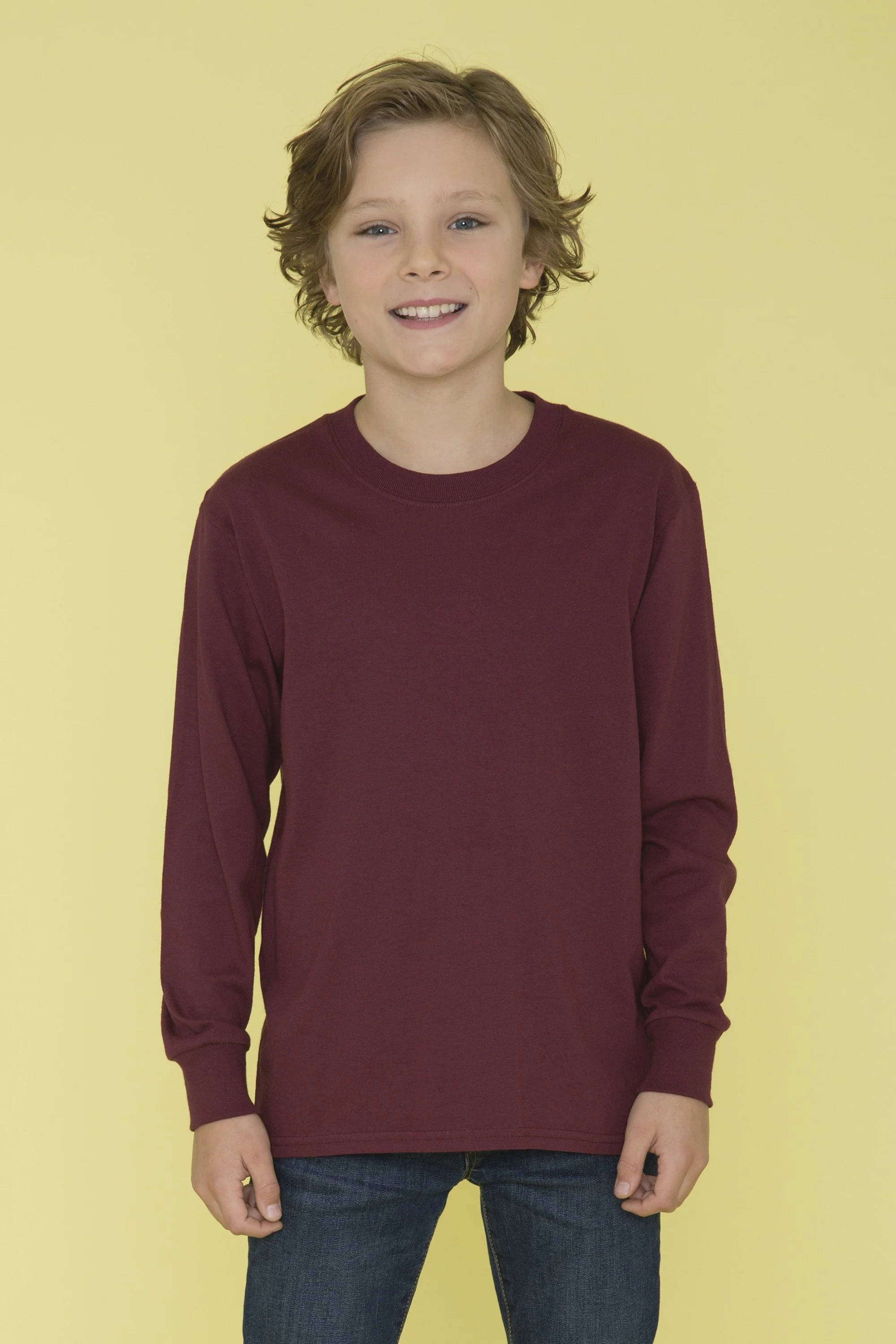 Young boy wearing ATC1015Y Everyday Cotton Long Sleeve Youth Tee