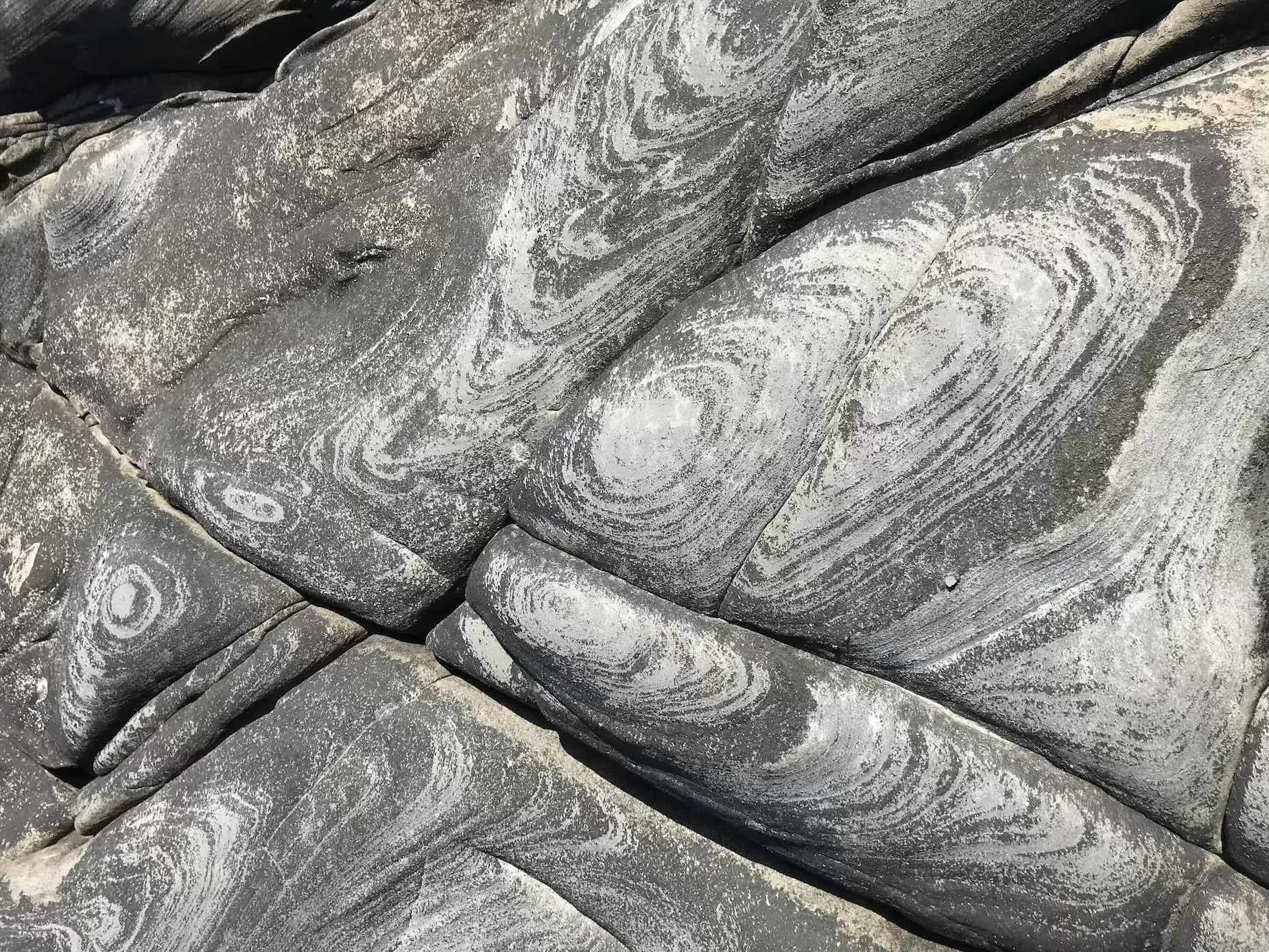 Swirling rock formation. Relational therapy for queer, trans, autistic adults. Online in SF Bay Area