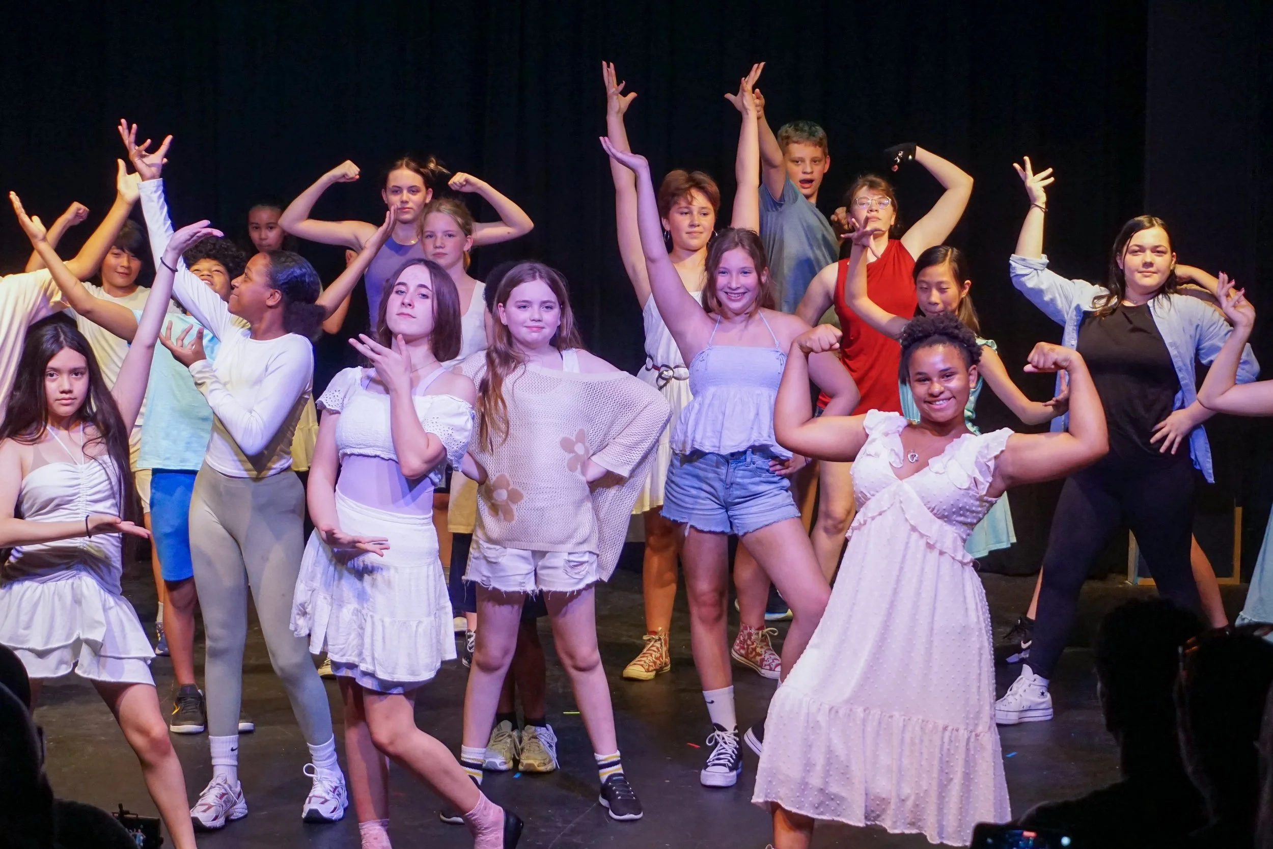 happy middle schoolers in a musical theatre show