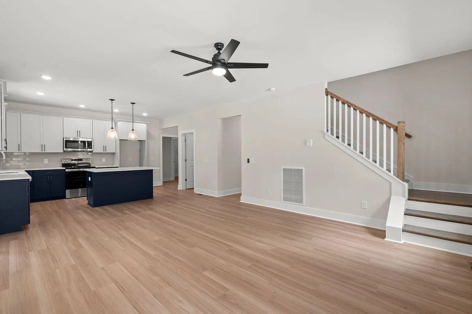 08-sandy-hill-farm-living-room-staircase.jpg