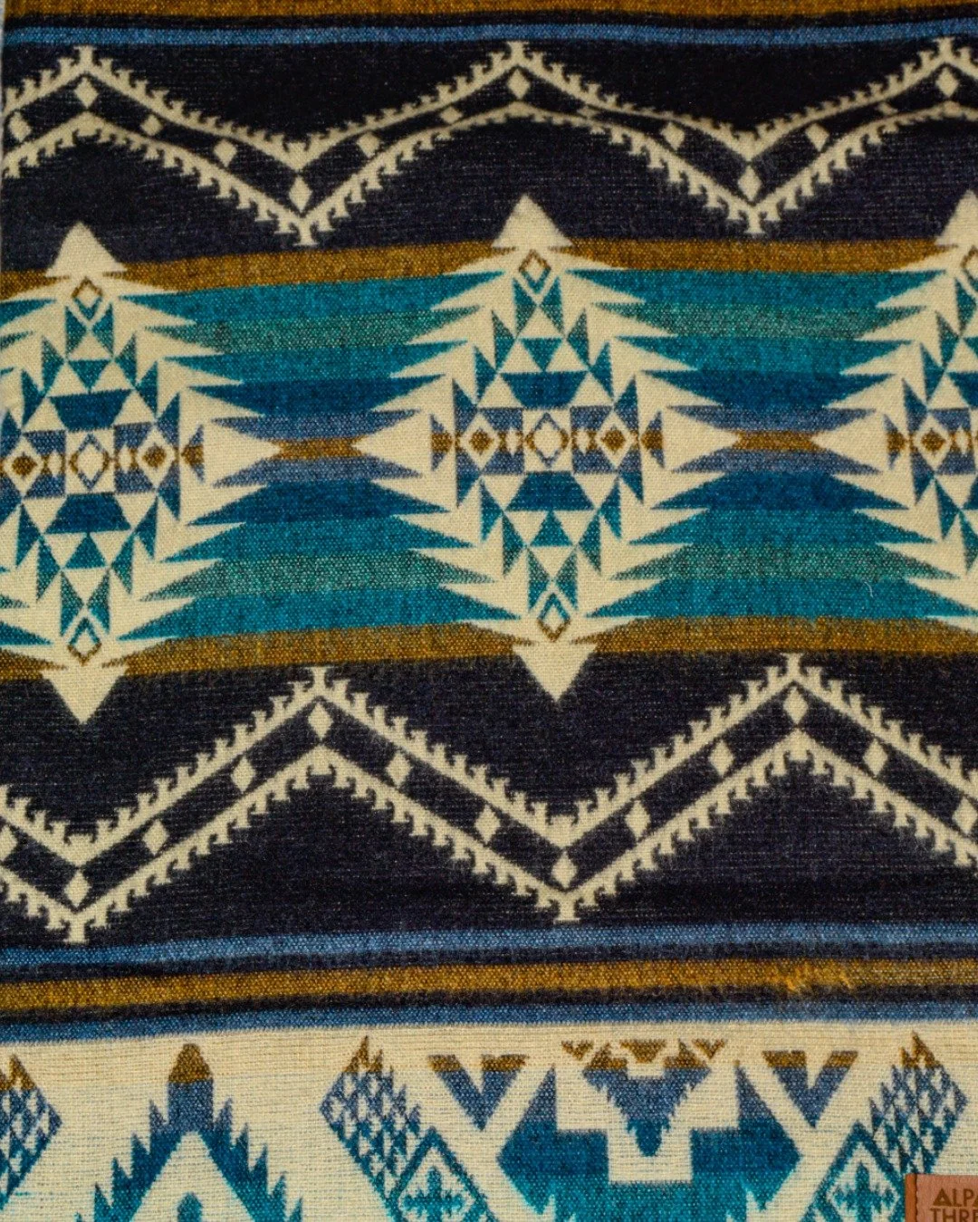 Find your perfect tribal throw blanket here at Rios Interiors &mdash; handmade with a luxurious blend of 50% Alpaca and 50% Acrylic textiles. Available in queen size or smaller options for your sofa. See one you love? Call us for more details at 817.