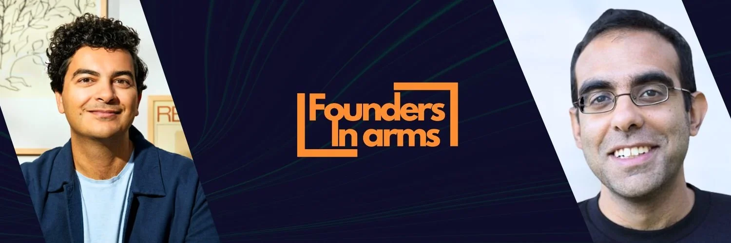 Image features two smiling men, Immad Akhund on the left with curly hair and a light blue shirt, and Rajat Suri on the right with short dark hair, glasses, and a black shirt. In the center, there is a logo that says 'Founders in Arms.'