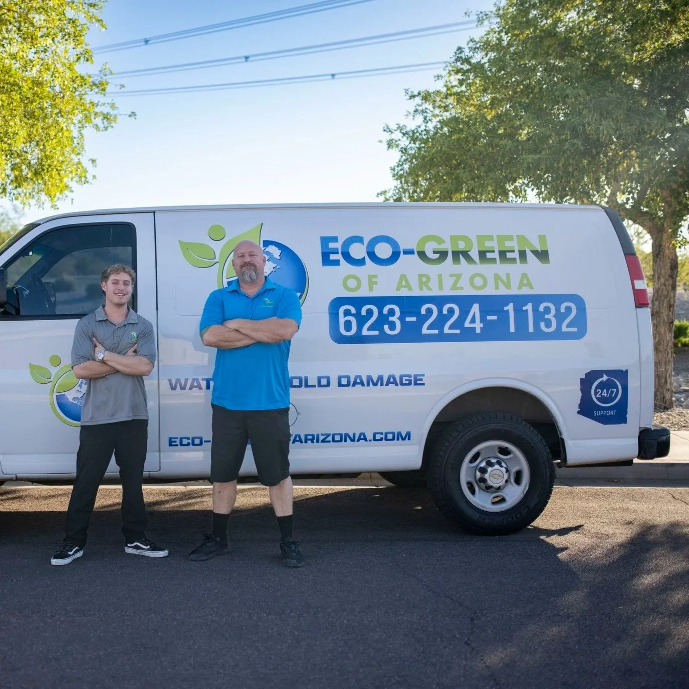 Professional applying waterproof sealant to floor tile grout lines in a Goodyear home to prevent moisture and mineral staining.