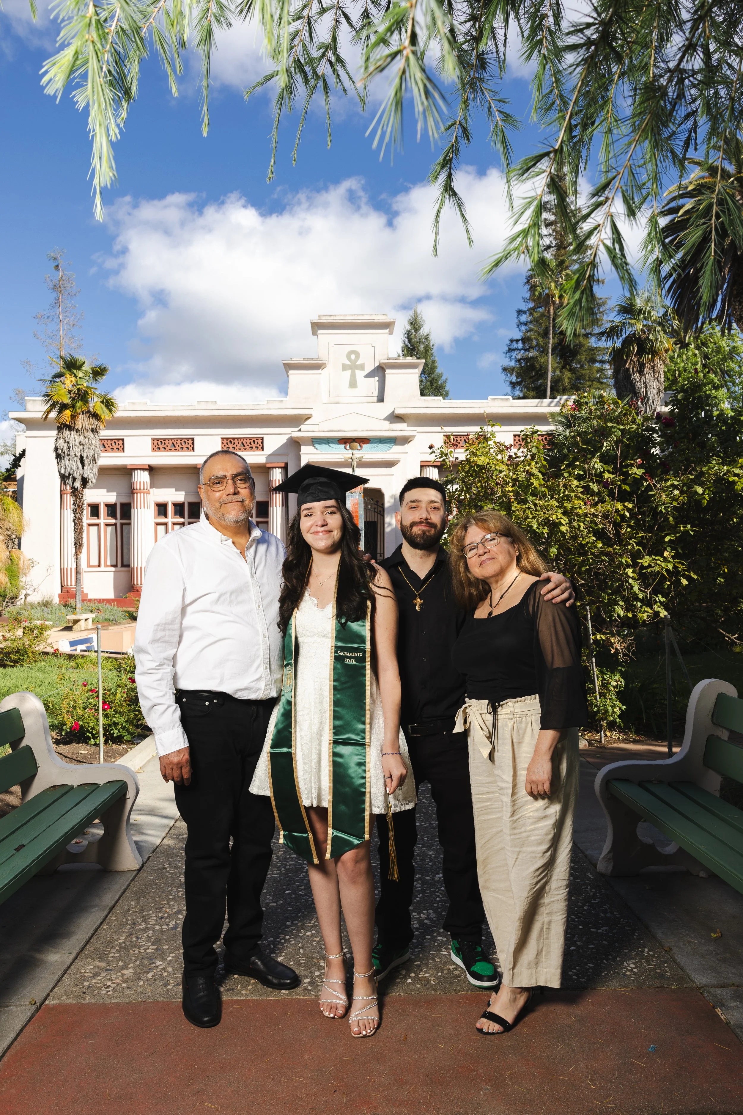 Graduate with family at graduation. Photo credit: Alex Knowbody