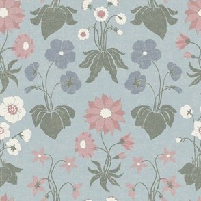 A dense pattern of hand-drawn floral elements in a variety of colors, including pink, cream, and blue, set against a soft smoke blue background. The design has a vintage feel with a textured appearance, evoking a calm and boho mood.