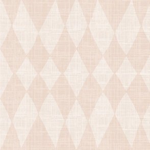 Wallpaper in soft warm pink with a rustic diamond pattern and linen-like texture, styled in a cozy, warm minimalist or boho southwestern interior setting.