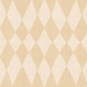 Wallpaper in pale straw yellow with a rustic diamond pattern and linen-like texture, styled in a cozy, warm minimalist or boho southwestern interior setting.
