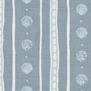 soft faded pastel mid blue textured wallpaper design with soft blue block print seashells and organic stripes giving coastal airy vibe.