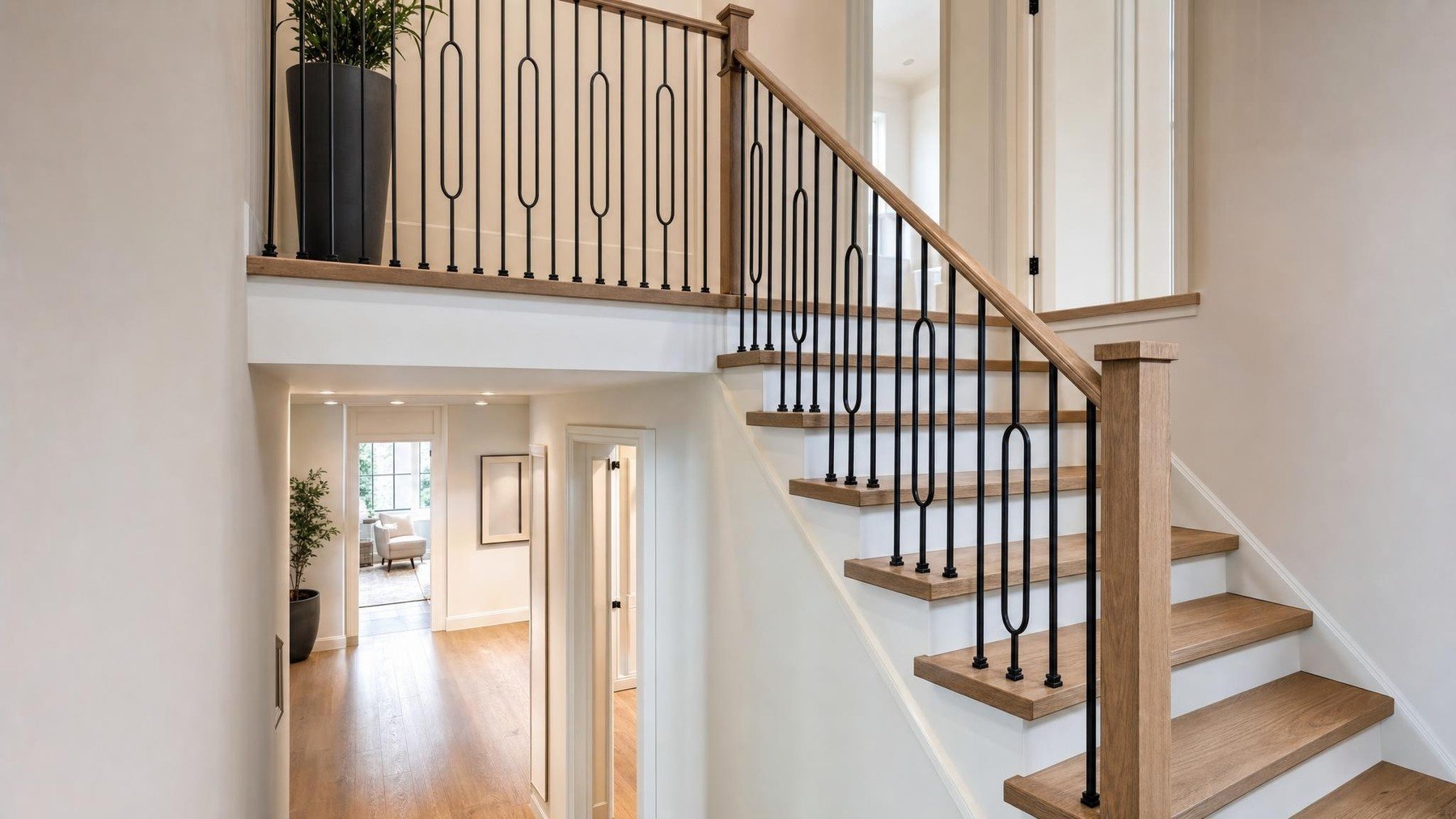 Oakville staircase with wood treads, coordinated railing, flooring, and trim prepared for renovation planning