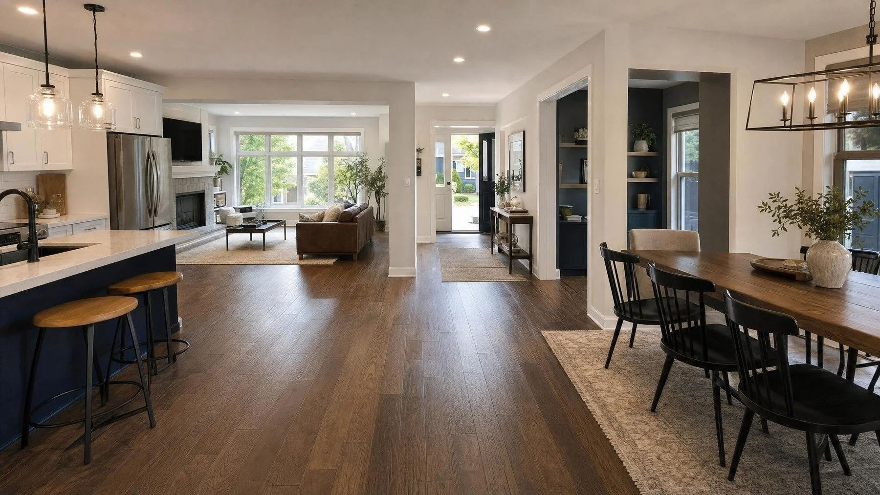 Connected Milton main floor renovation with coordinated kitchen, dining, flooring, millwork, and lighting