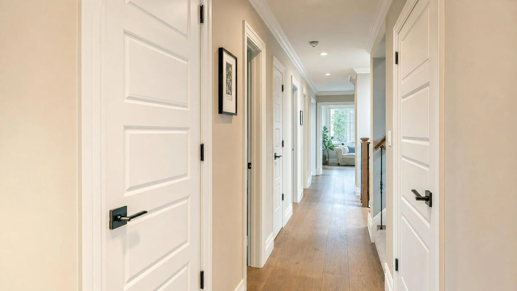 Oakville interior hallway with coordinated replacement doors, trim, flooring, and hardware