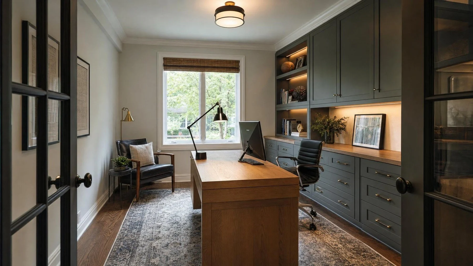 Residential Oakville home office with built in storage, task lighting, power access, and fitted blinds