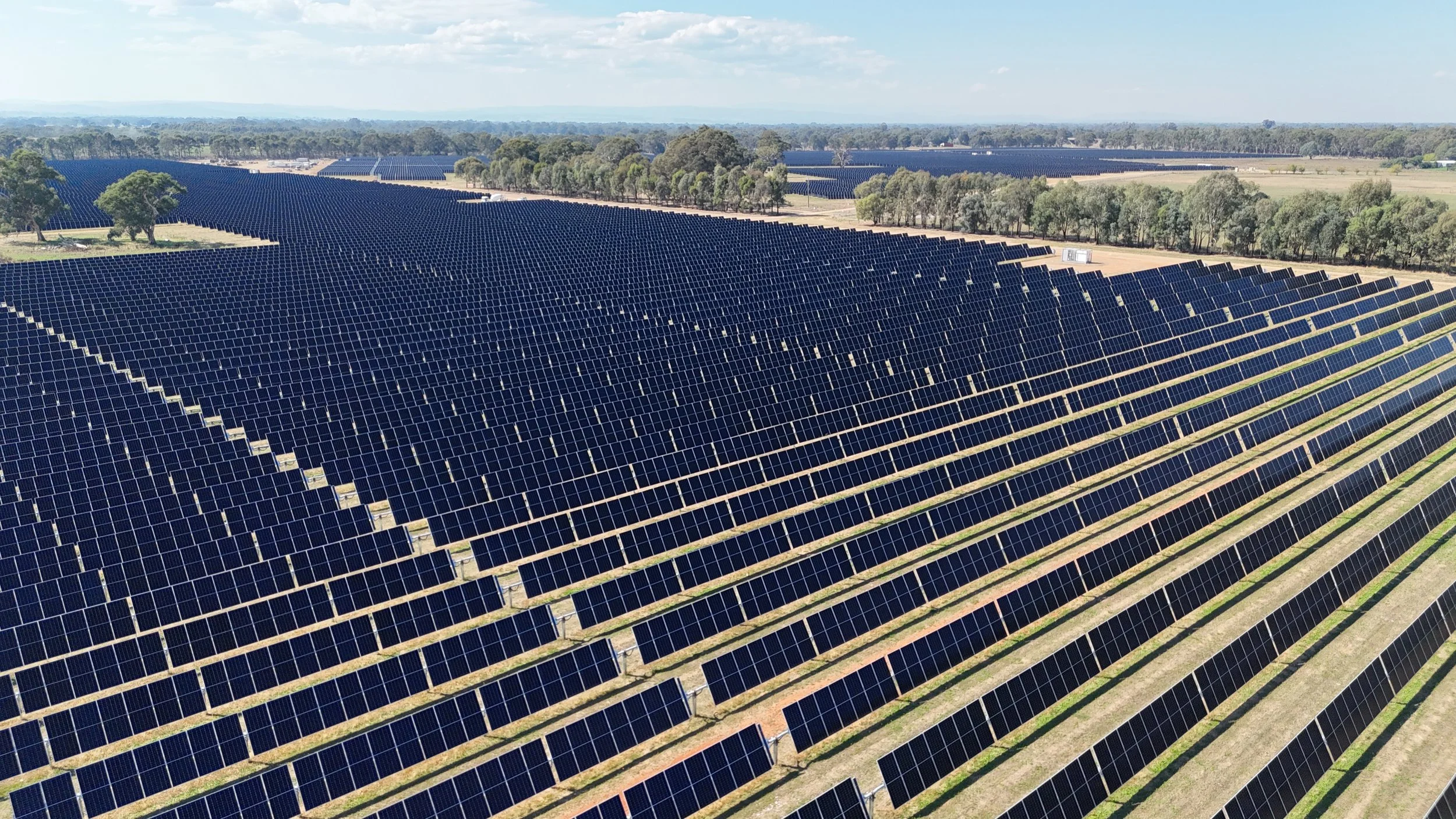 Aerial view of Wangaratta Solar Farm with rows of solar panels in regional Victoria