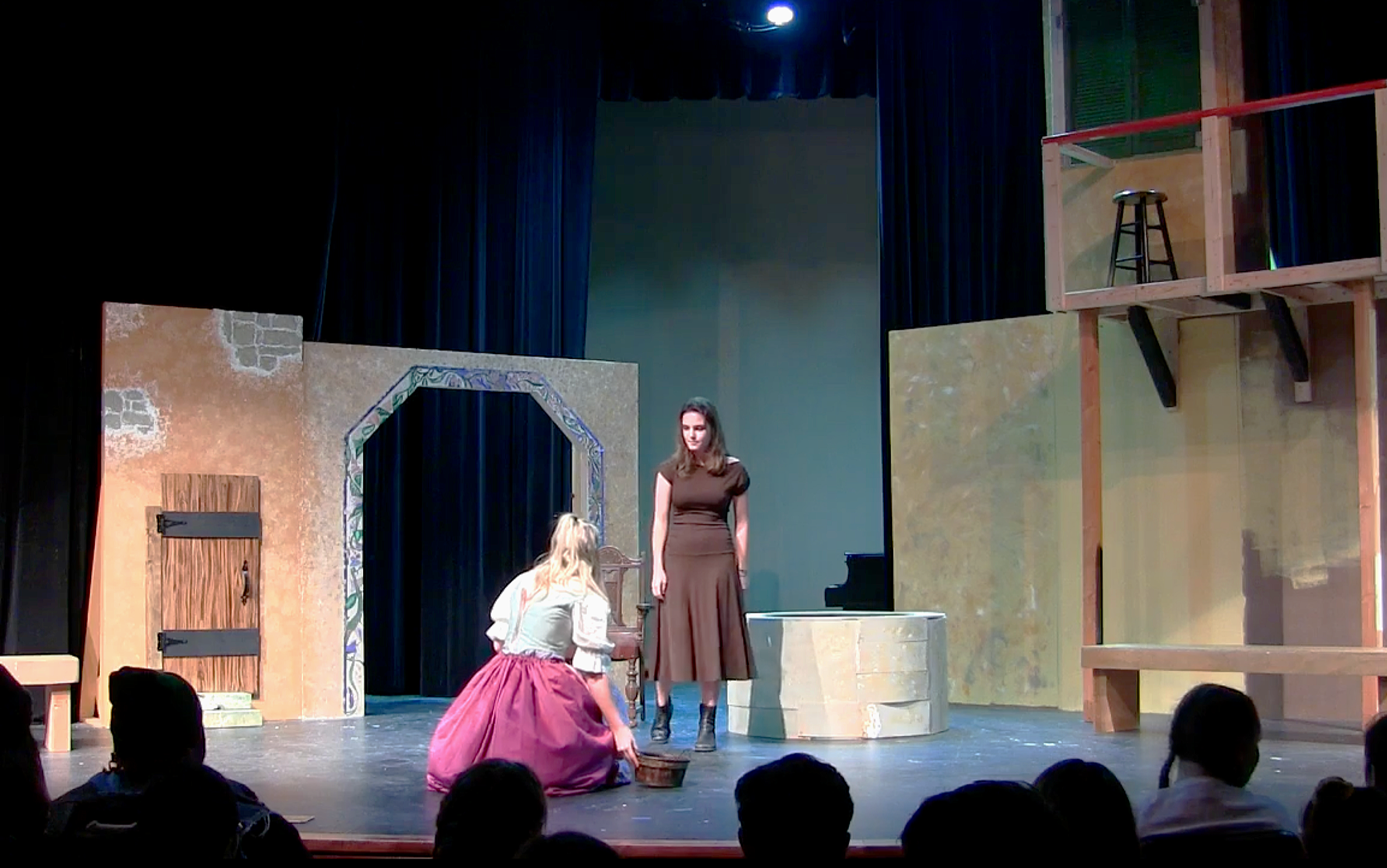 Tableau from Clara Holland's 'Glass Slipper'. Cinderella and her Evil Mother, with set pieces including a door, window, and balcony, and scenery suggesting a cozy interior.