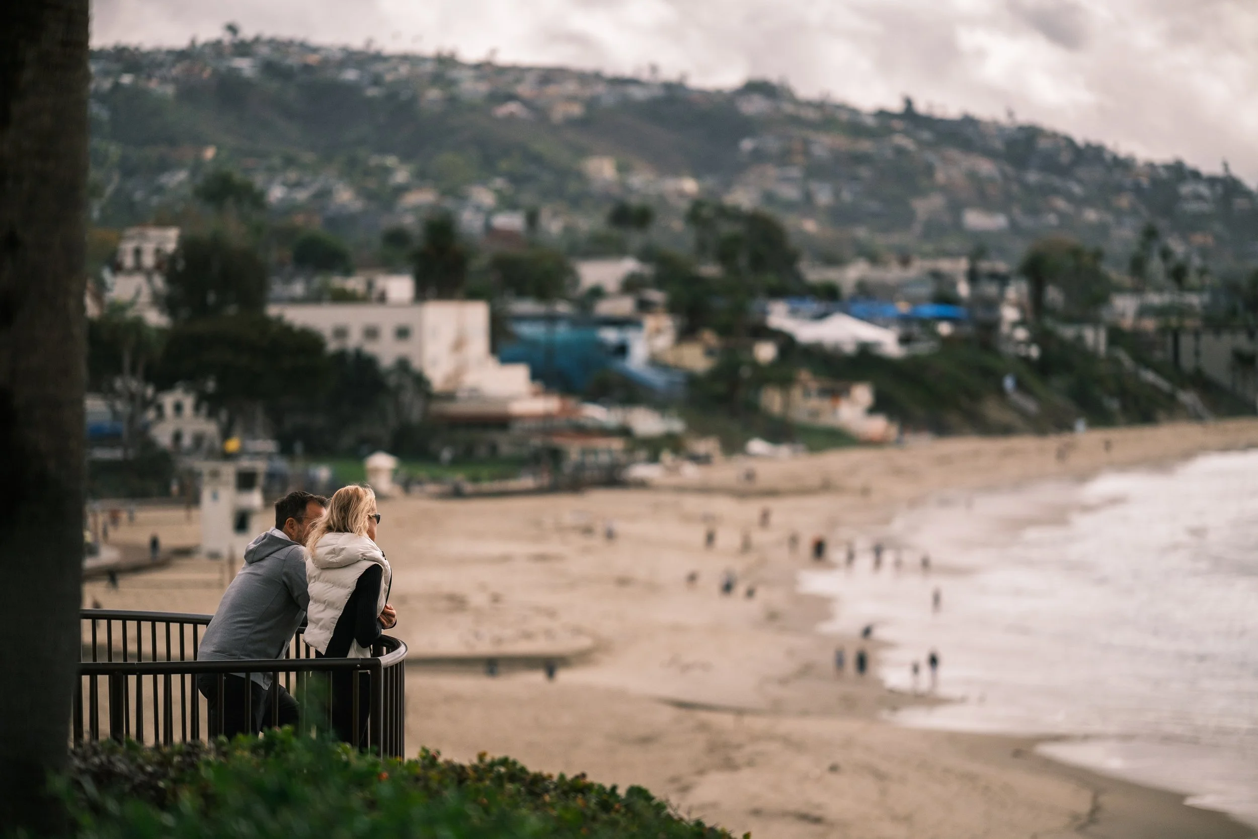  Looking back from Heisler Park, where the lens compression stacks the Laguna hills against the misty shore. 