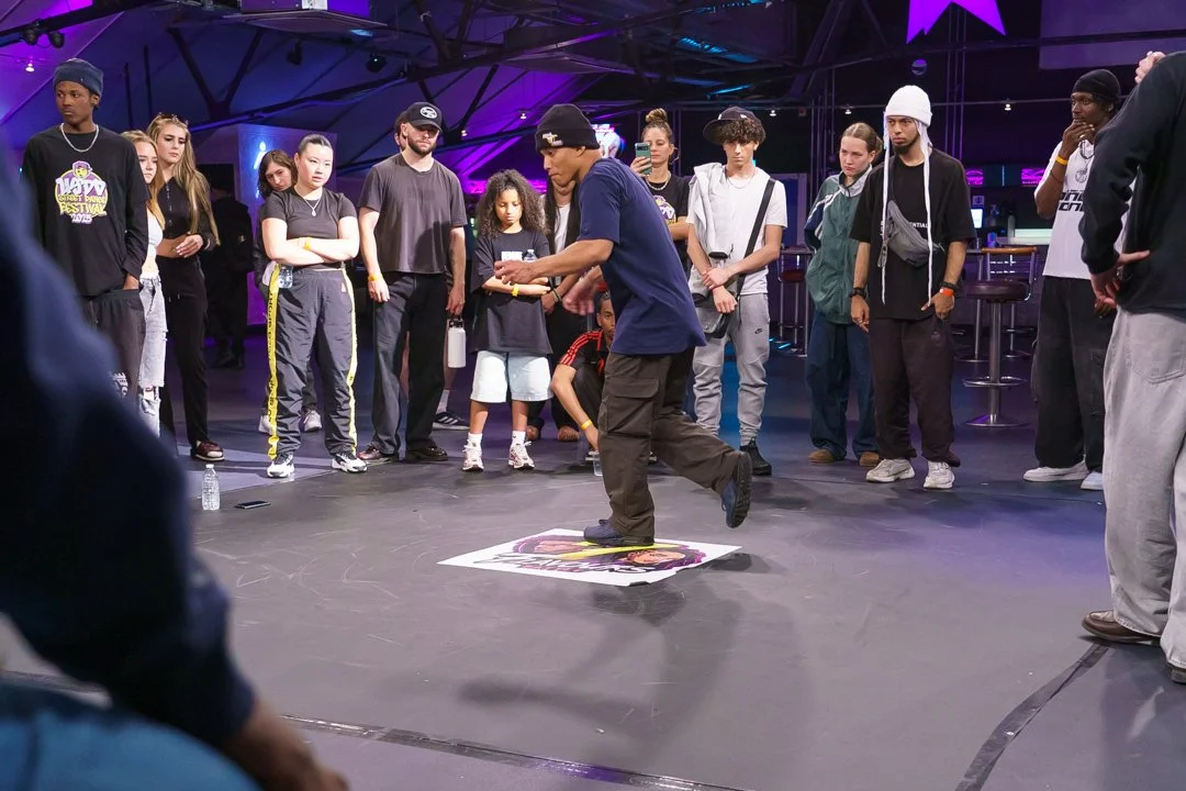 Past edition: dancer on the battle floor with the community at USDD Street Dance Festival 2025.
