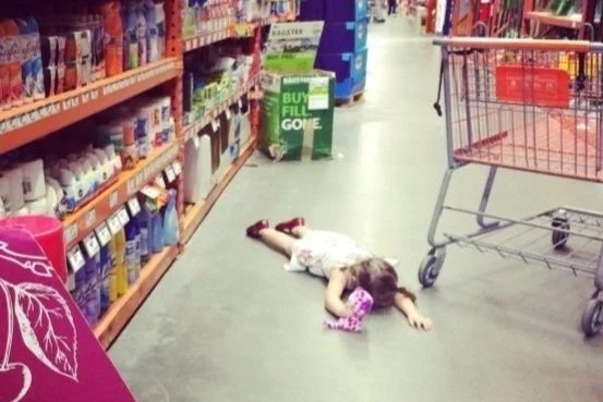 Toddler having a tantrum in the middle of a store aisle