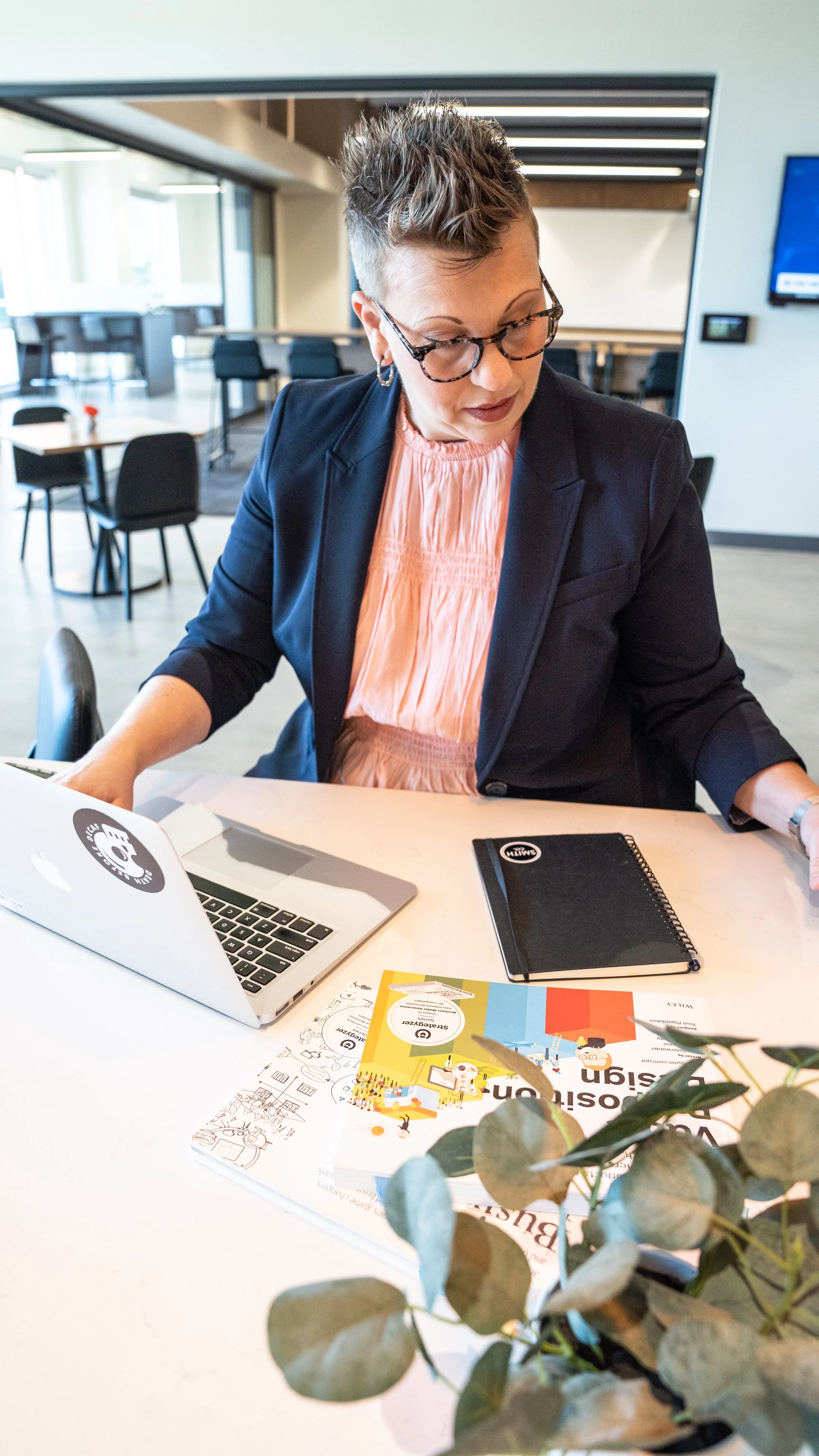 B2B sales coach sitting at a laptop