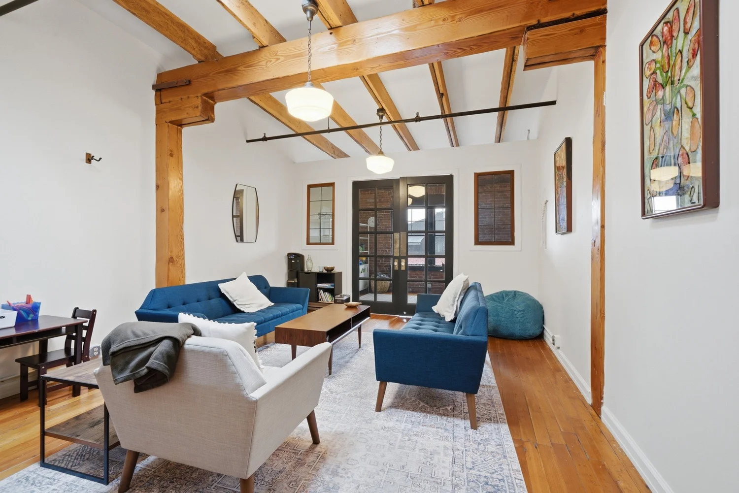 Sunlit office suite with exposed timber beams in the Gadsby Building