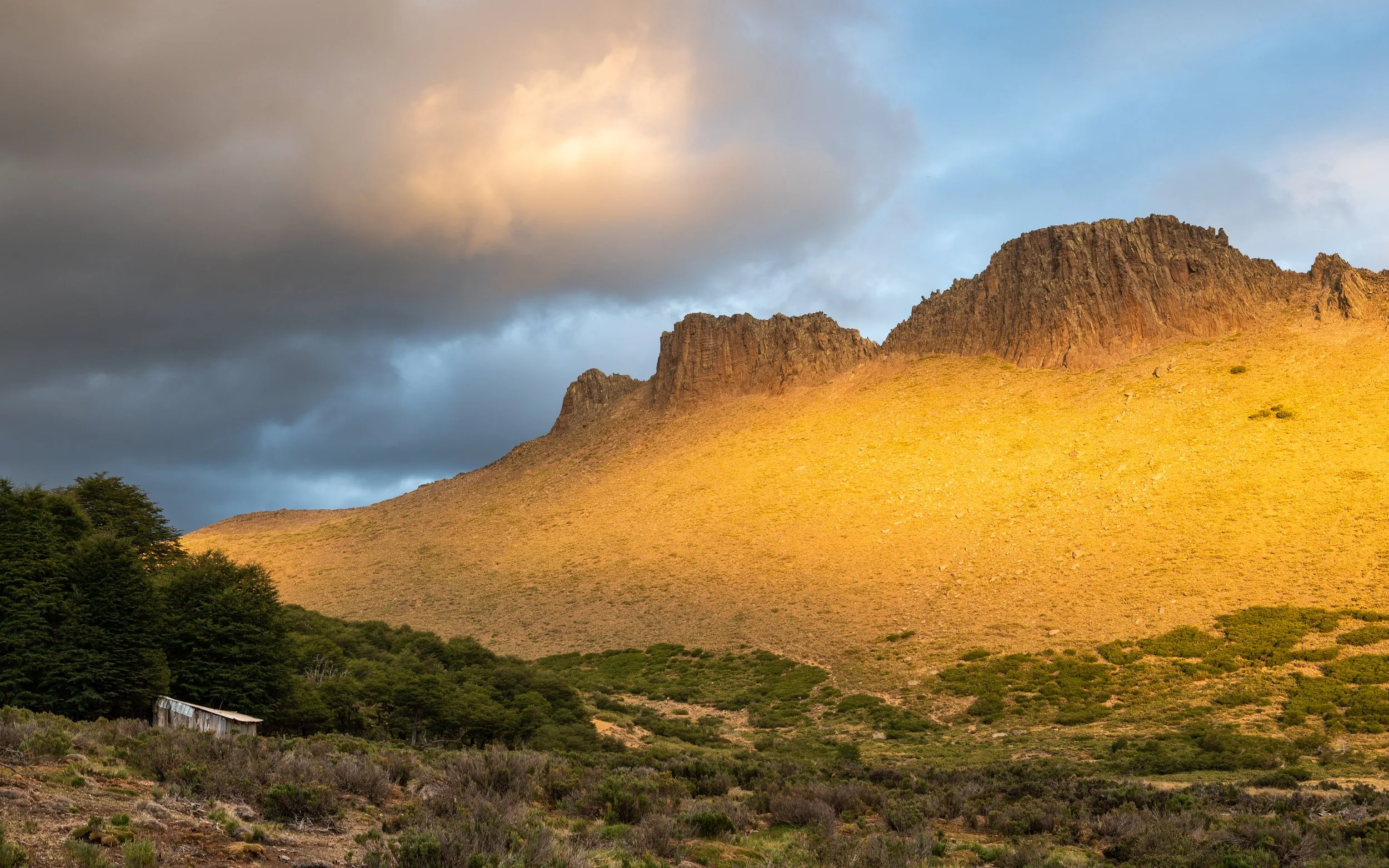 At Laguna Verde, we pitched our tent under the trees to shield against the fierce winds of an approaching storm, right next to a welcoming local family. They herd sheep and goats around the fertile pastures and call this place home from November to M