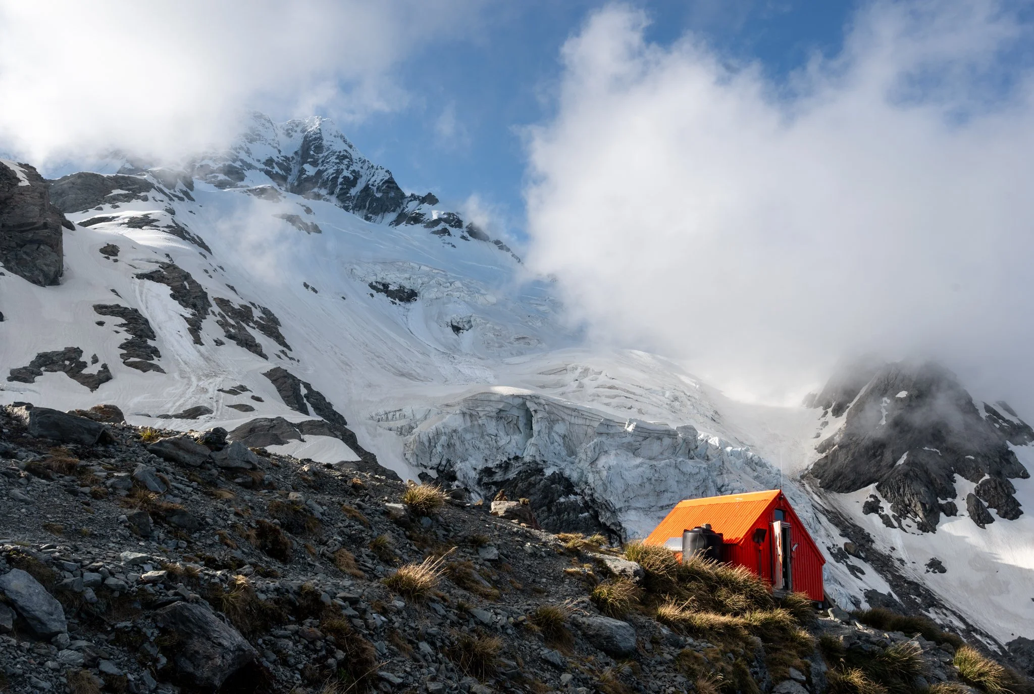 Sefton Bivvy and overhanging Tewaewae Glacier above it. The proximity of the ice was imprevice and. 