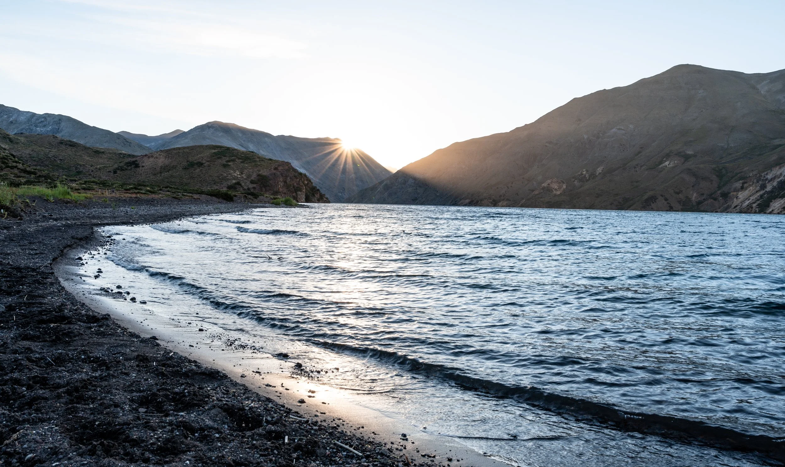 The sun sets over Laguna del Dial, and the temperature drops quickly after dark.