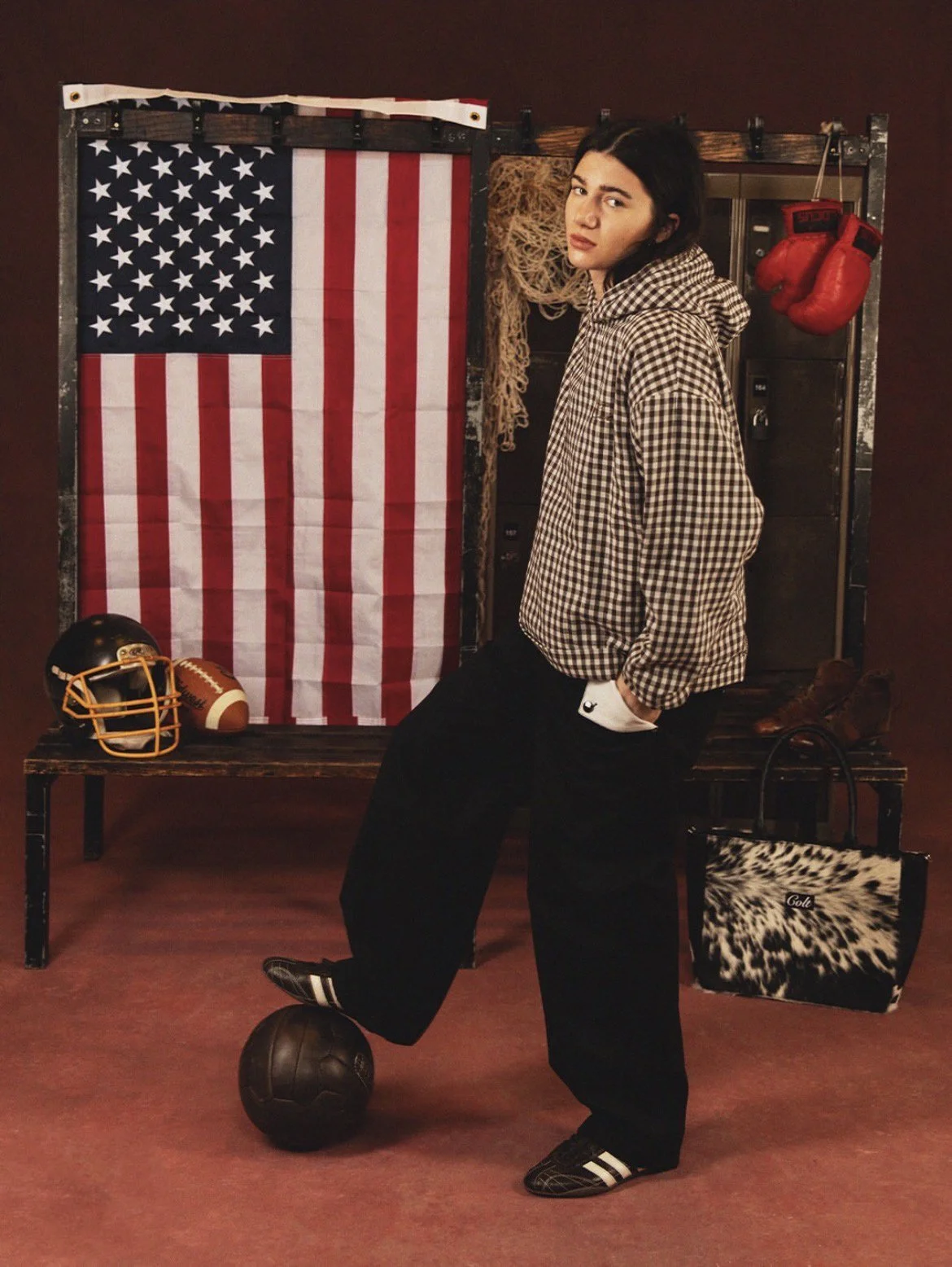 Red textured hand-painted canvas photography and film set backdrop shown in use for a women's fashion campaign photoshoot.