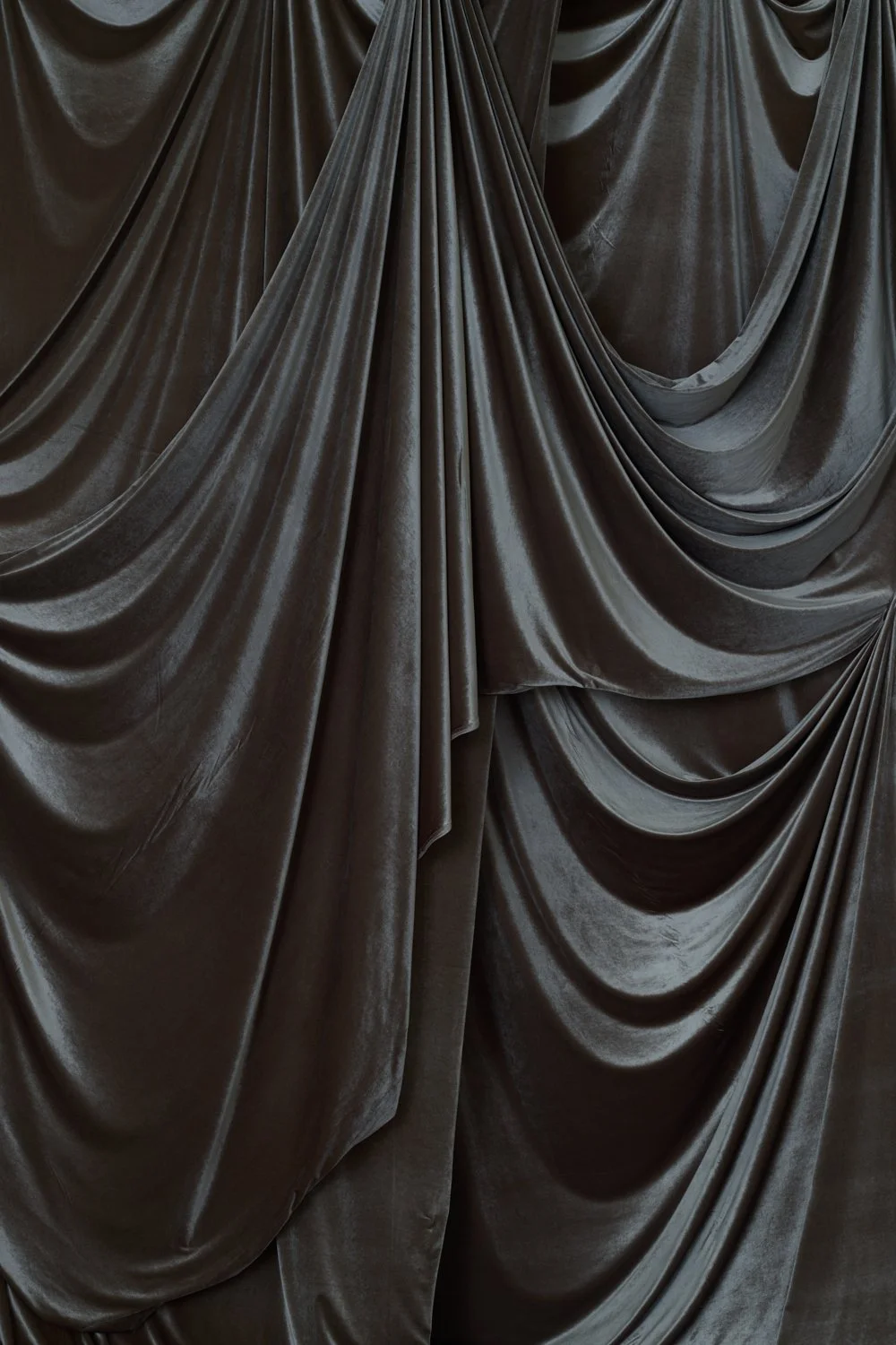 Silver and grey mix velvet drapery photography backdrop available to rent throughout the UK from Manchester based Hollins Backdrops 