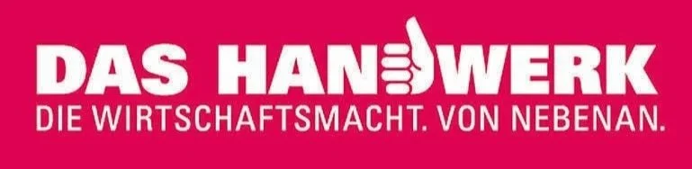 Logo with bold white text on a pink background reading "DAS HANDWERK" with a thumbs-up icon integrated into the letter 'I', and smaller white text underneath saying "DIE WIRTSCHAFTSMACHT. VON NEBENAN."